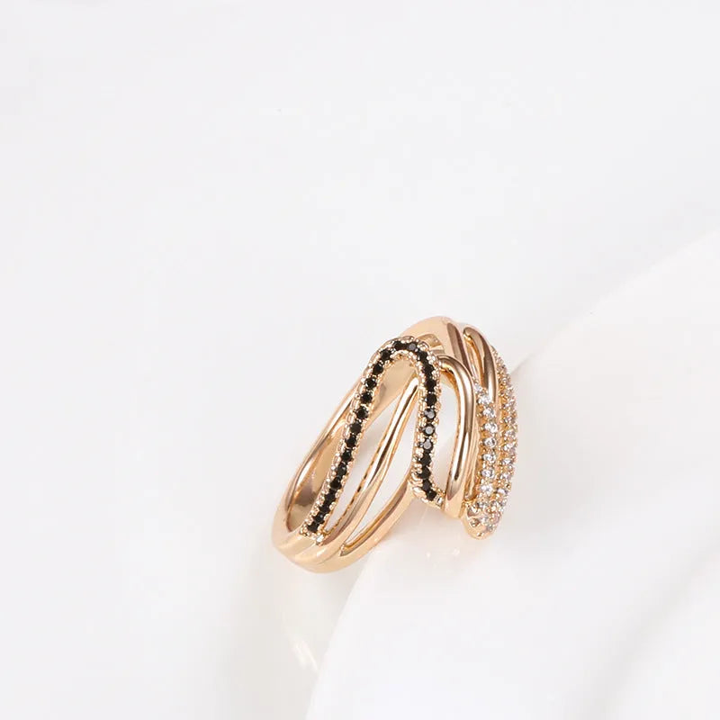 Gold tone women's copper ring with micro-inlaid sparkling zircon stones on a finger.