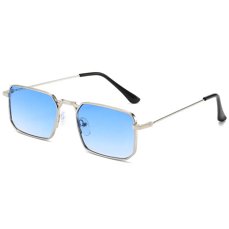 Square-shaped steampunk sunglasses for men with gold frame and grey lenses on a plain background