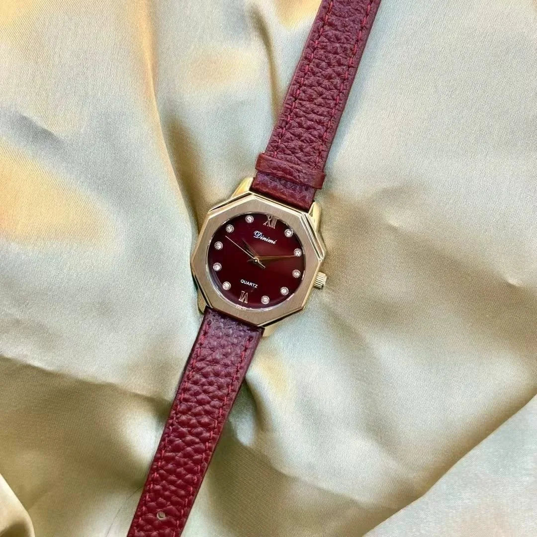 Chinese style red alloy women's wristwatch with a decorative dial on a 8mm thick case.