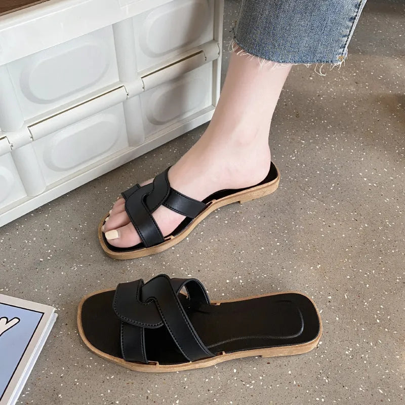 Women's PVC cross strap sandals in light blue colour showing non-slip sole and toe ring design