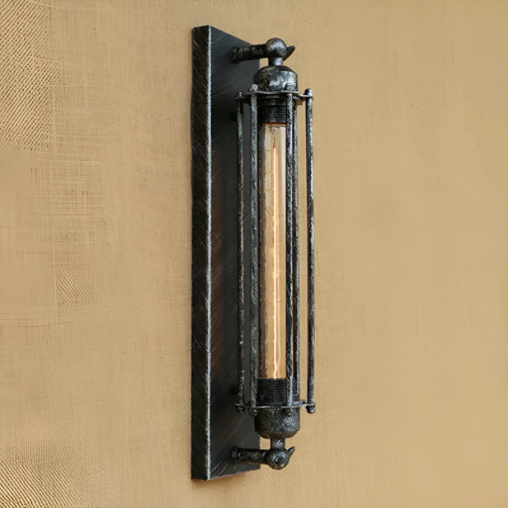 Industrial retro flute shaped iron wall lamp in an antique finish, shown mounted on a wall.
