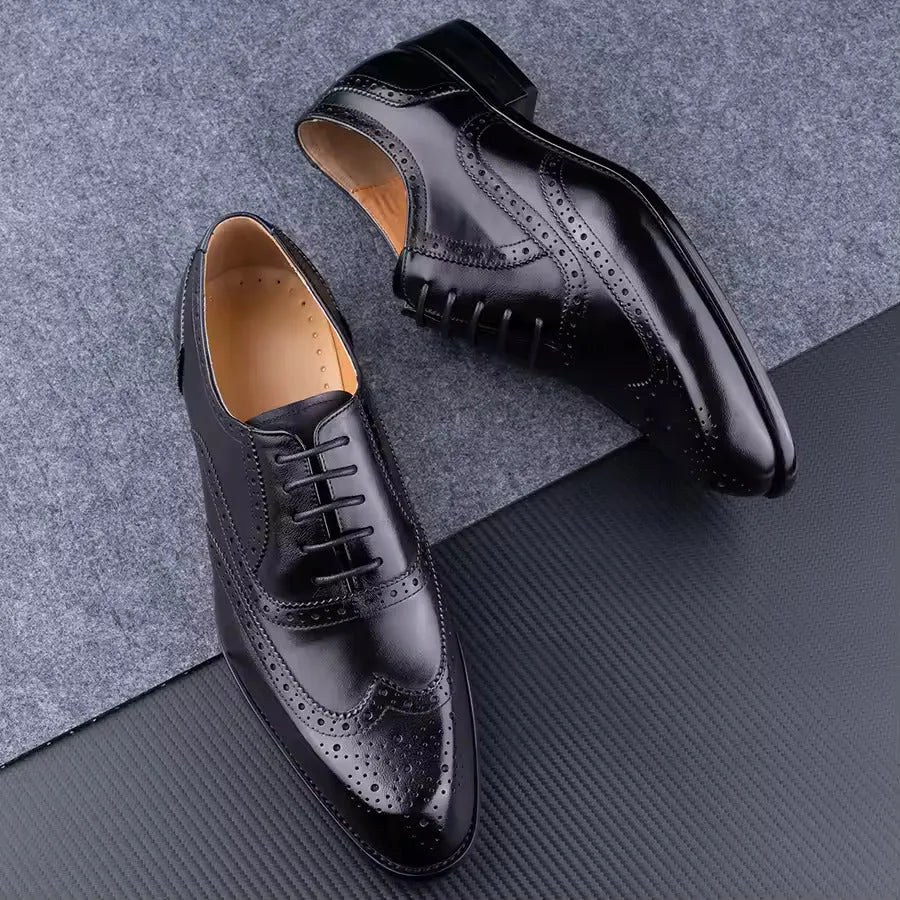 Men's purple leather Oxford dress shoes with hand-carved detailing and pointed toe on a rubber sole.