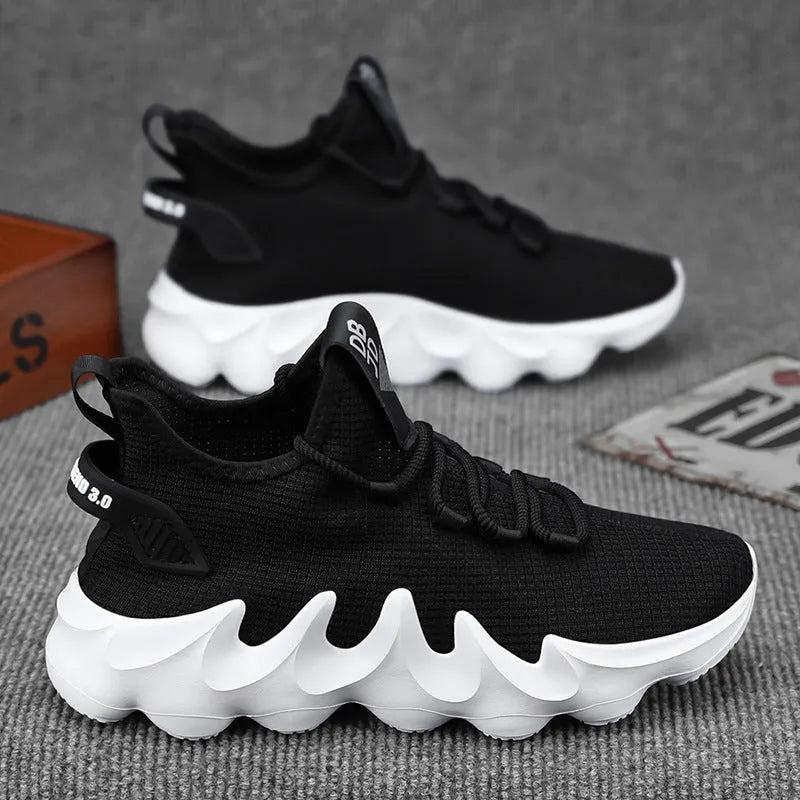 Men's black low-top sock-like sports shoes with a lace-up front and wear-resistant sole on a white background.