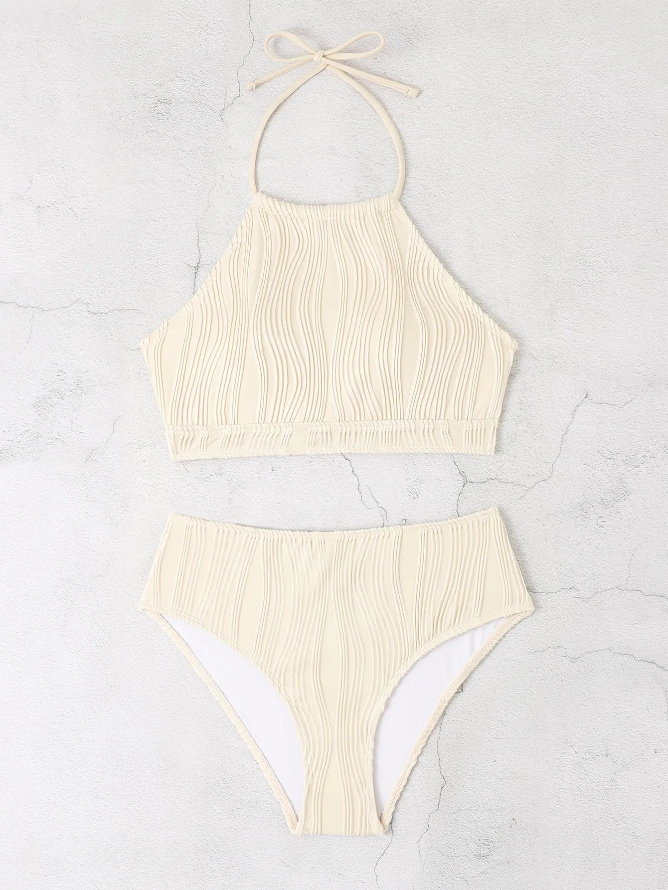Conservative high-waist apron-style one-piece women's swimsuit in solid colour.