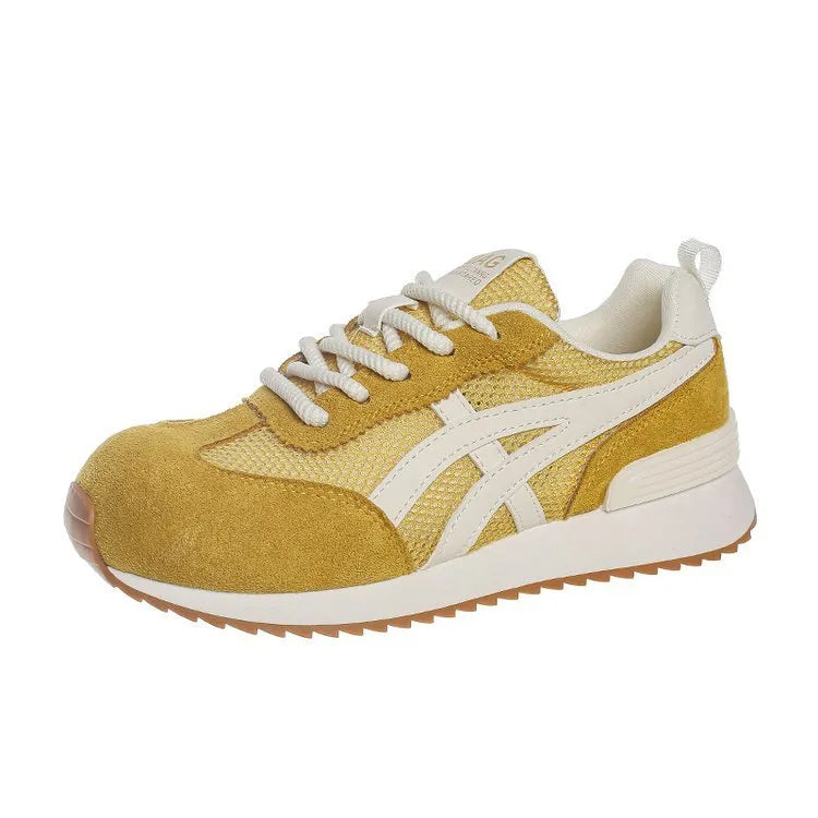 Women's white casual lace-up sneaker with non-slip sole on neutral background