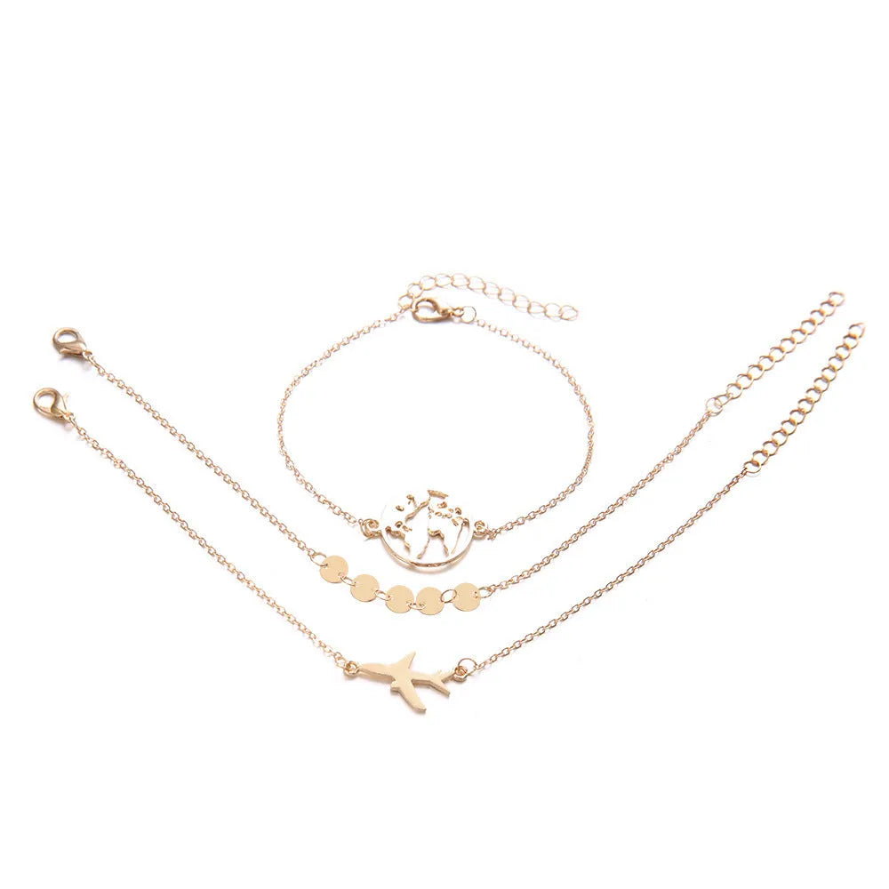 Three silver Bohemian bracelets with heart-shaped charms showing aircraft map details