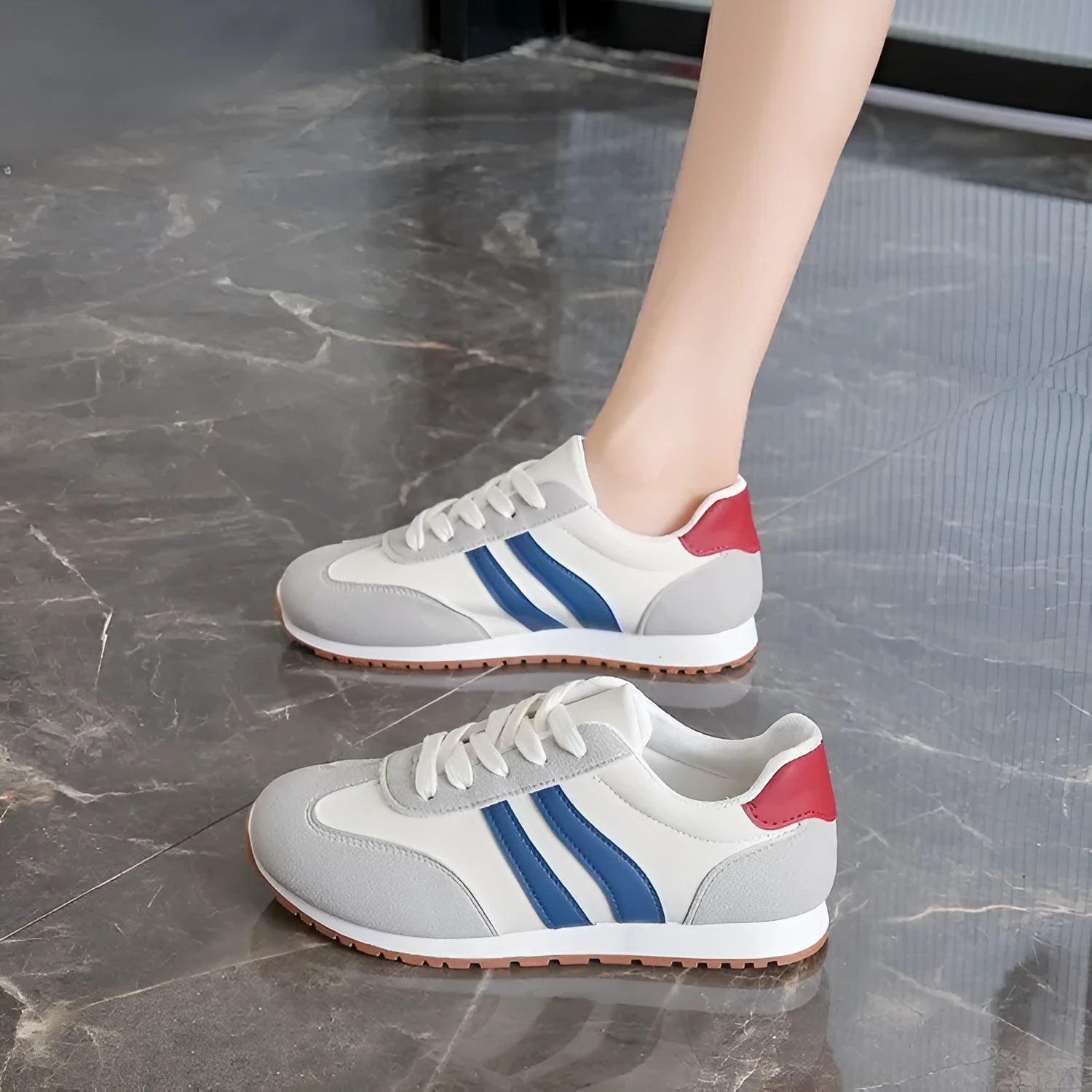 Blue and grey striped Cortez-style casual shoes with round toe and flat rubber sole