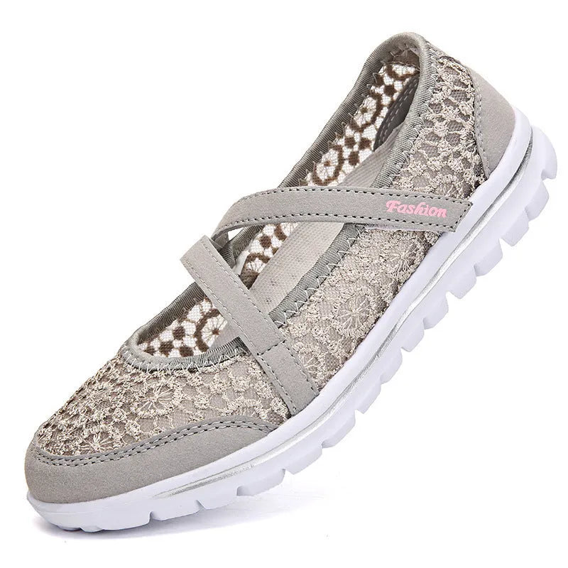 Women's mesh lace-up casual flat shoes in beige colour showing round toe and flat heel design