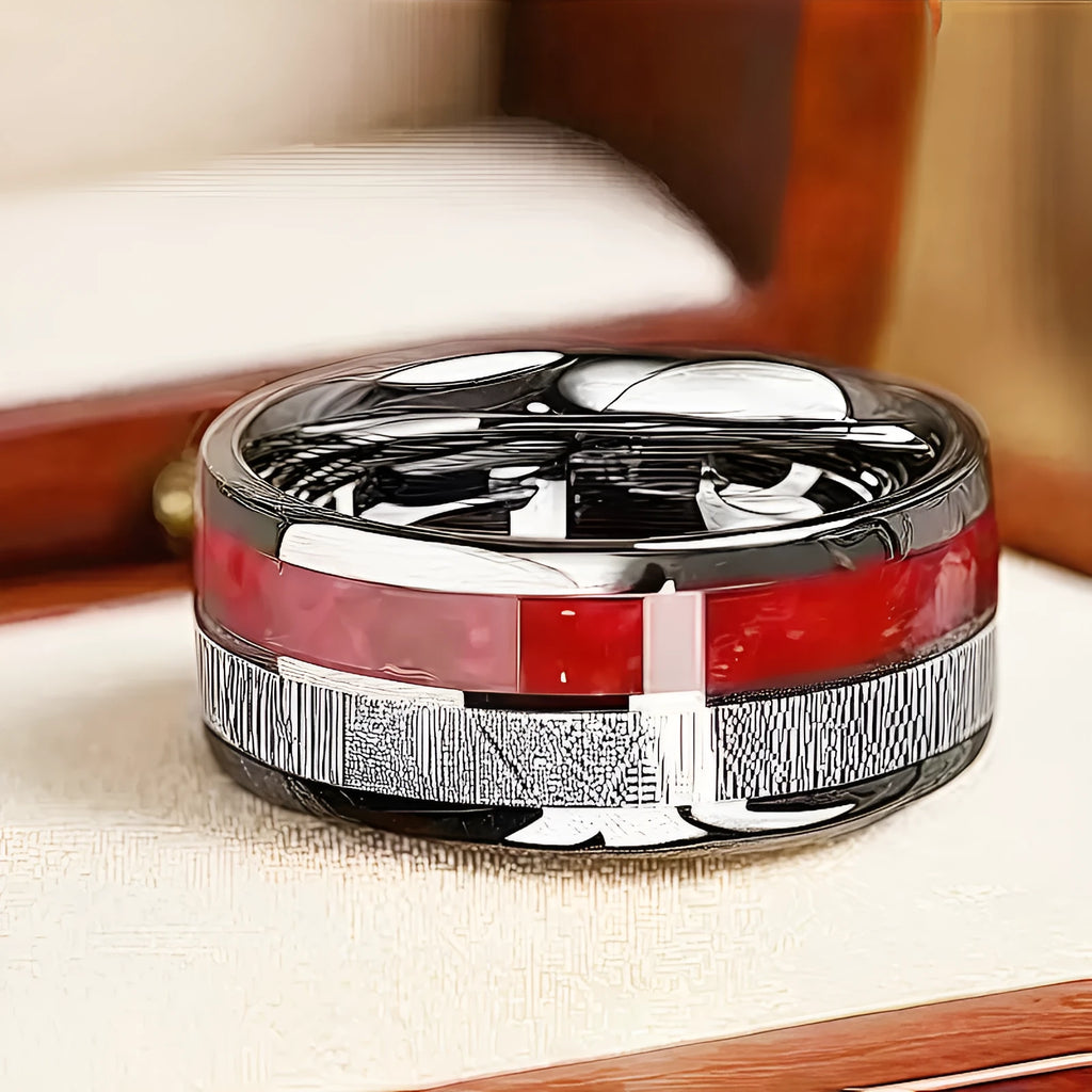 Two-tone silver red stainless steel ring with textured surface on white background