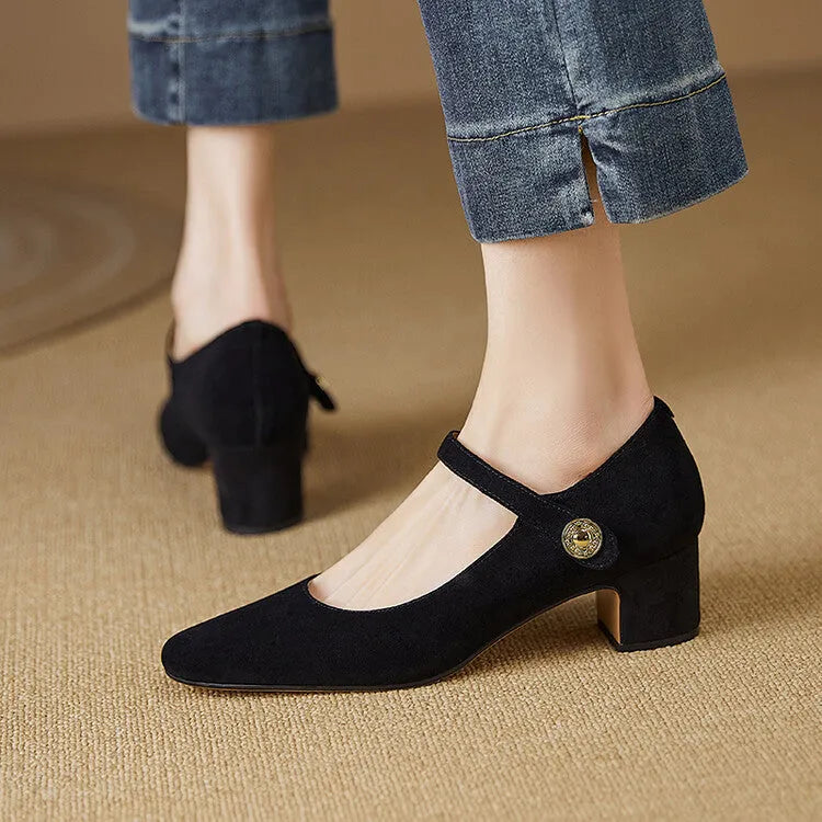 Women's black suede Mary Jane shoes with a chunky heel and square toe on a white background