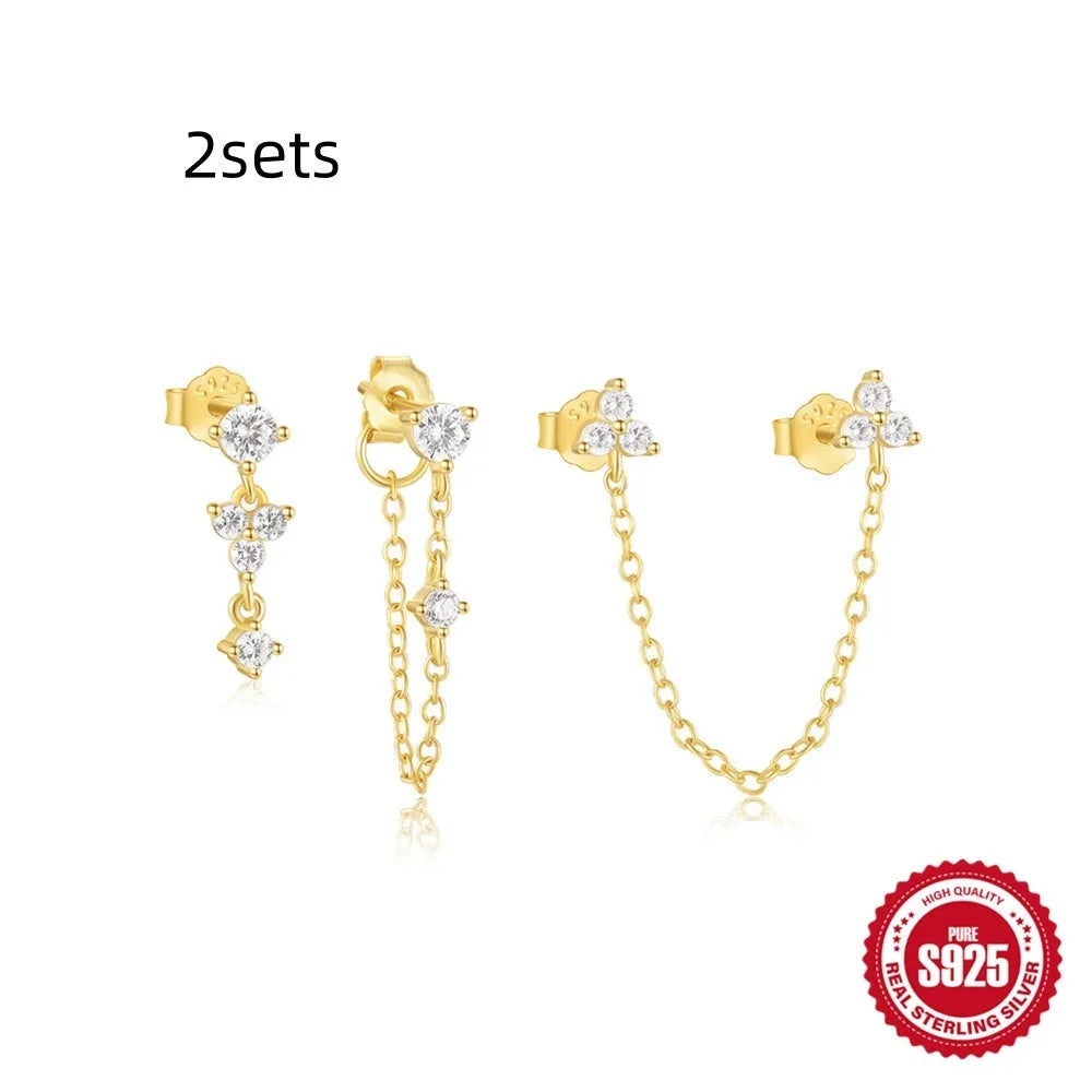 Set of three S925 sterling silver geometric zircon tassel earrings for women on a plain background.