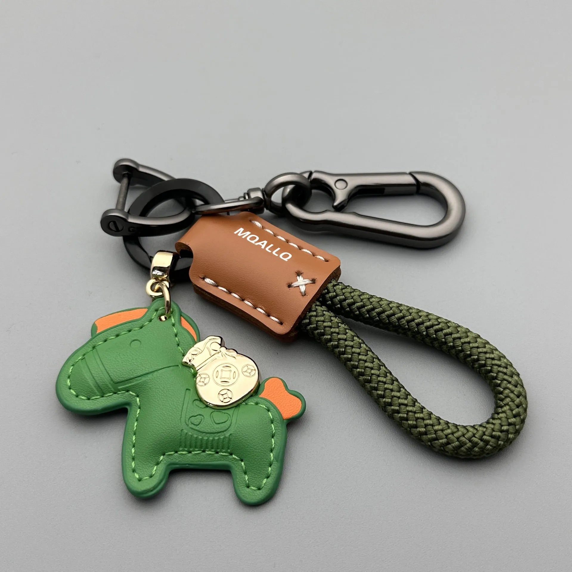 Handmade cowhide car key ring pendant with zinc alloy pony belt buckle on a colourful flanelle rope.