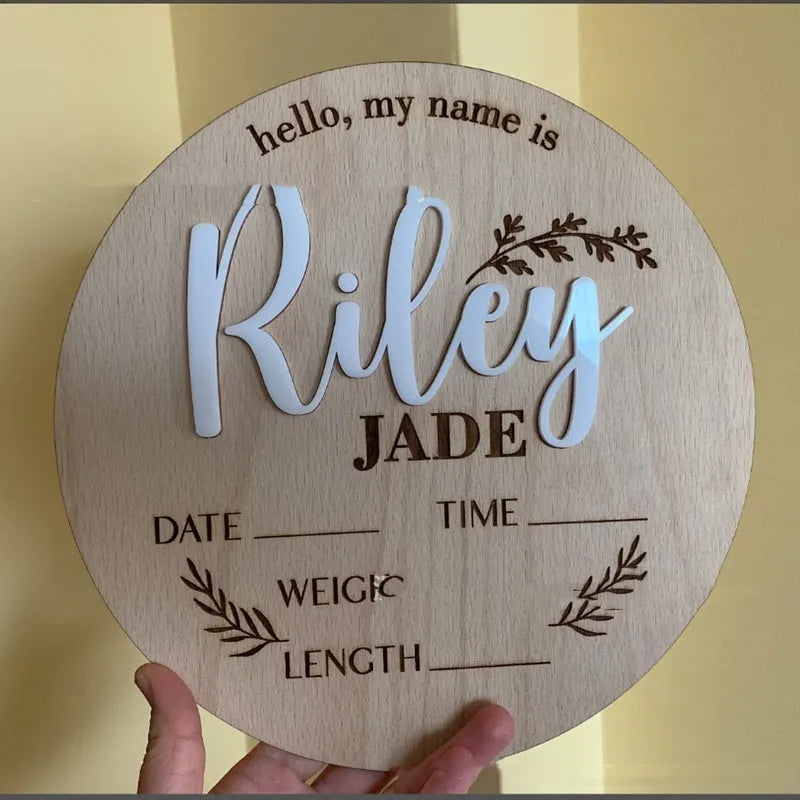 Square wooden baby name label with birth details in one of three style choices.