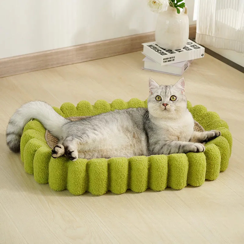 Green oval cat scratcher pad with sisal material and integrated cat bed bowl design