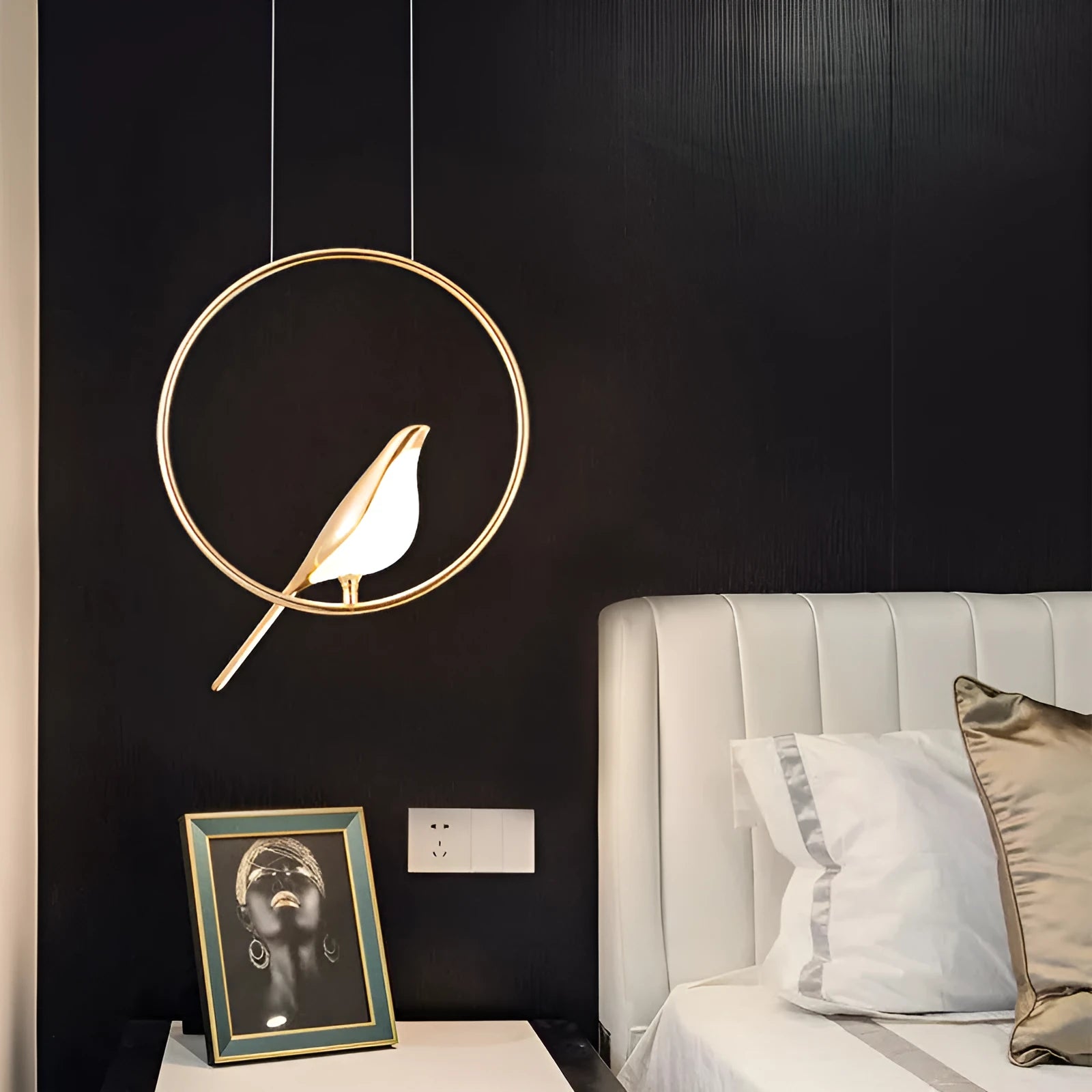 Modern silver magpie bird chandelier with long 150cm drop and clear acrylic details, hanging from a ceiling.