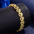 Gold-plated copper heart-shaped bracelet on neutral background showing 18.5cm length