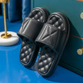 A pair of soft EVA bathroom slippers with a thick sole, shown in a choice of colours including black, caramel, green, pink, and yellow.