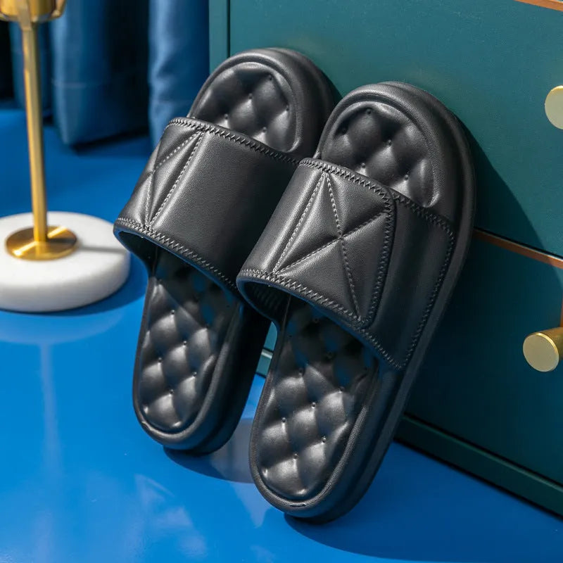 A pair of soft EVA bathroom slippers with a thick sole, shown in a choice of colours including black, caramel, green, pink, and yellow.