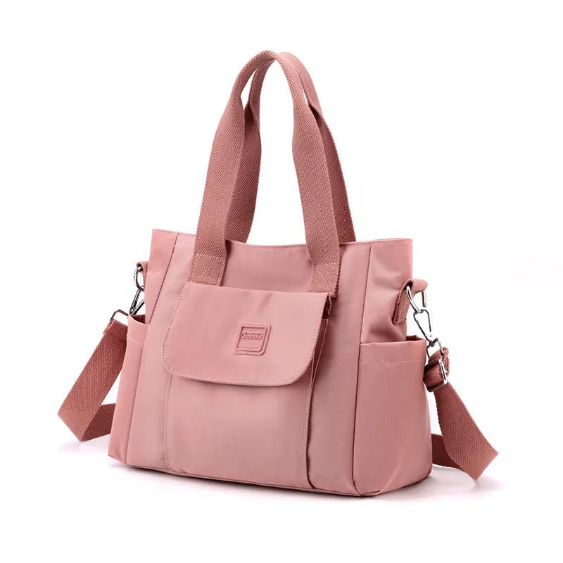 Nylon multi-interlayer shoulder bag in black with single strap and outer sandwich pocket, horizontal square shape