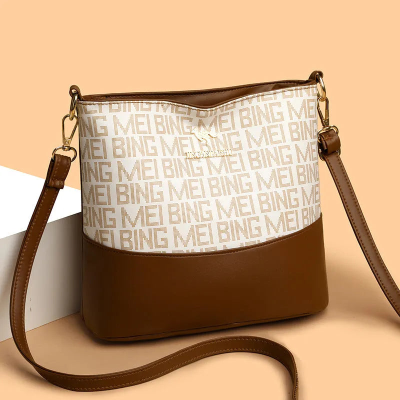 Brown soft PU leather messenger bag with external pocket and organised interior compartments.