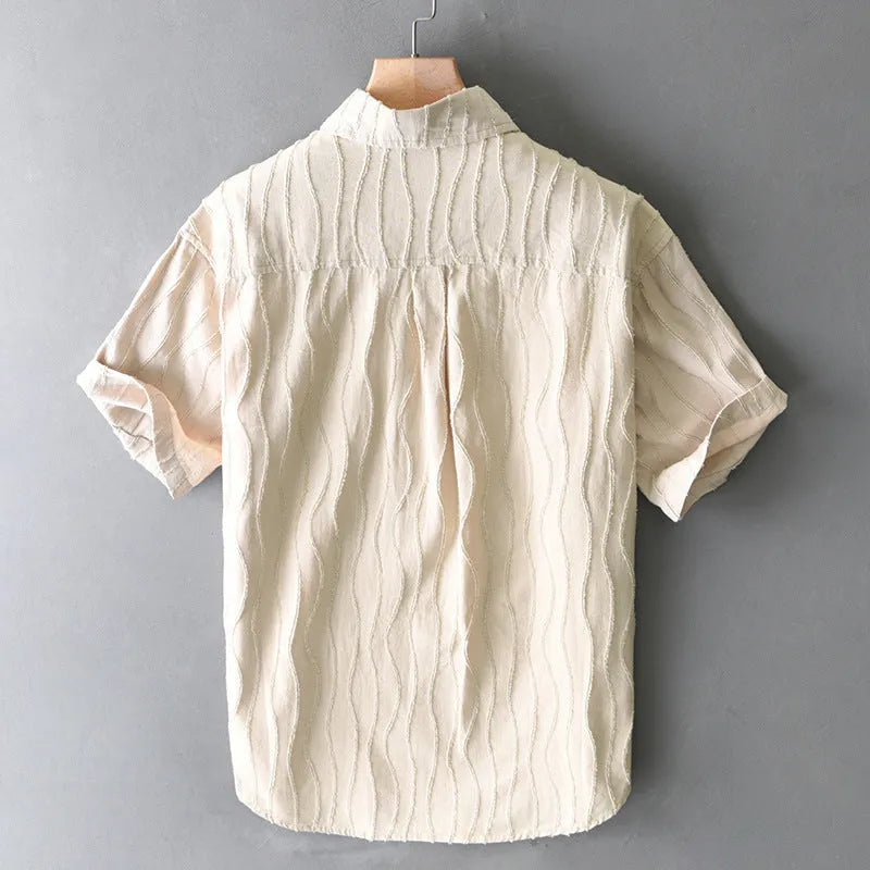 Men's loose fit pure cotton short sleeve casual shirt in apricot colour on a hanger.