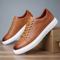 Men's black low-top leather business shoes with a leather toe cap and rubber sole
