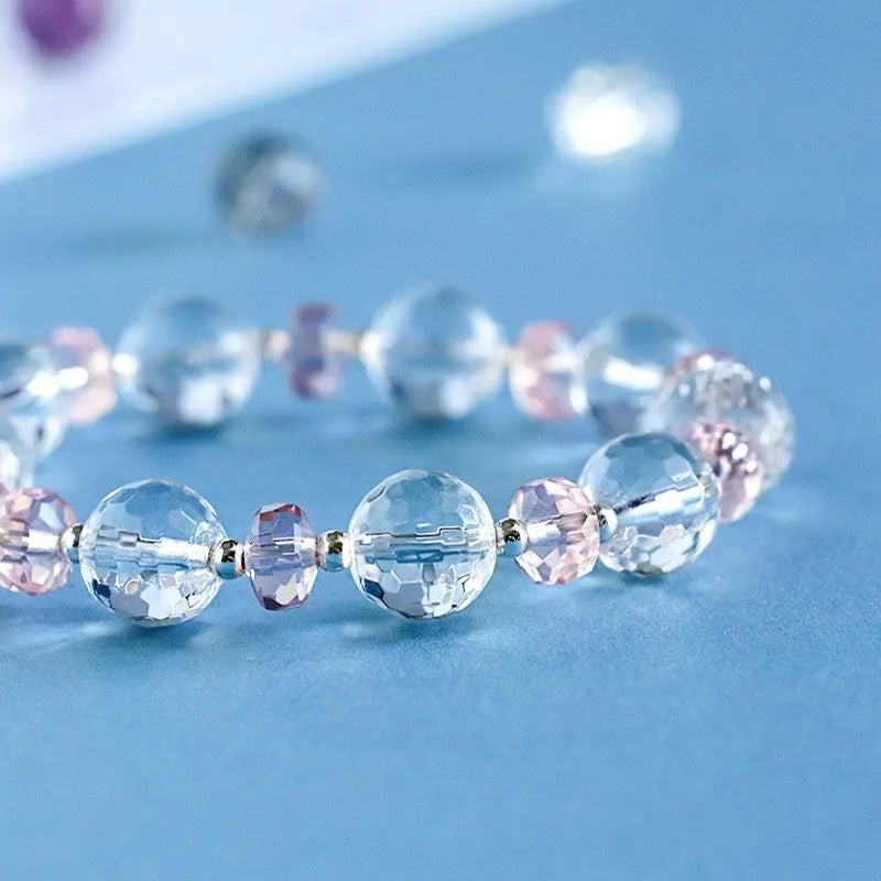White crystal bracelet with lucky cat charm and diamond-shaped XINGX crystal centrepiece