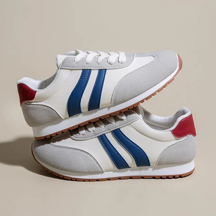 Blue and grey striped Cortez-style casual shoes with round toe and flat rubber sole