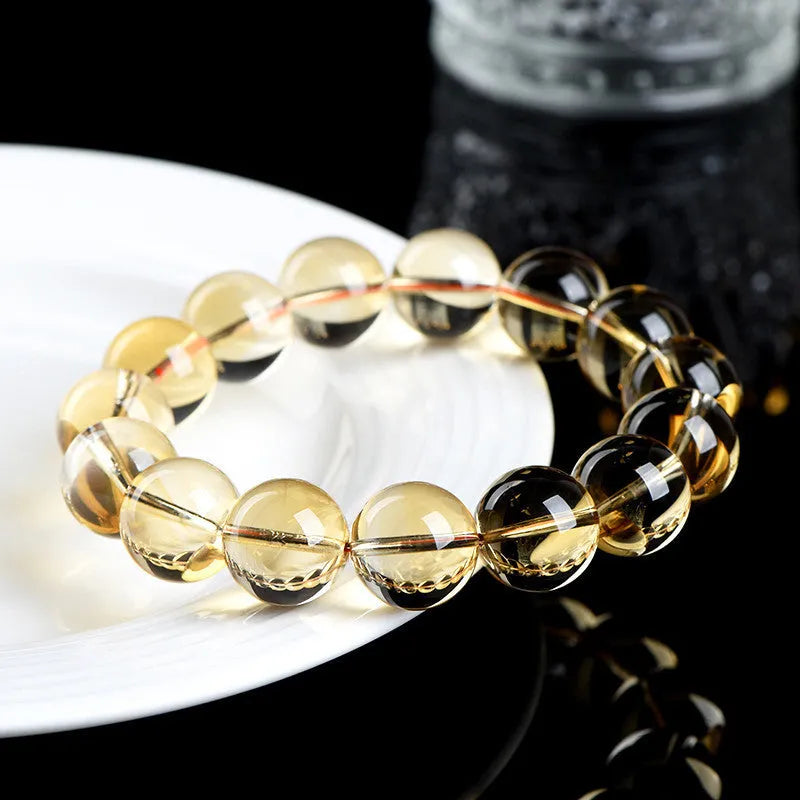 Original design natural citrine scattered beads ball bracelet showing polished yellow stones in a textured arrangement.
