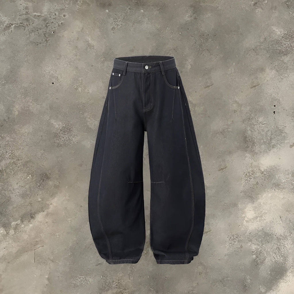 Men's wide leg denim trousers in original cow colour showing mid waist and relaxed fit.