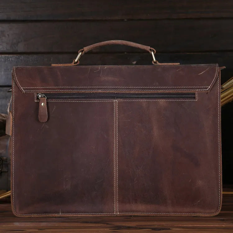 Men's yellow brown cowhide leather messenger bag with shoulder strap and nylon lining.