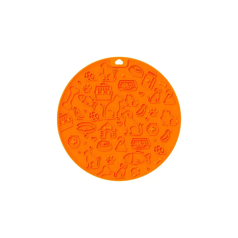 Round silicone pet licking mat with suction cups on a flat surface.