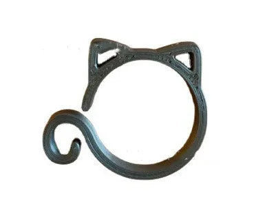 A colourful cat-shaped plastic clip for securing plant stems in the garden.