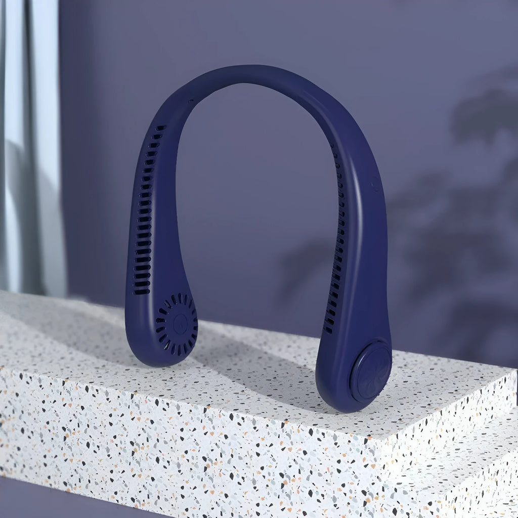 Blue bladeless neck fan hanging around a person's neck, showing the air outlet and USB charging port.