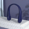 Blue bladeless neck fan hanging around a person's neck, showing the air outlet and USB charging port.