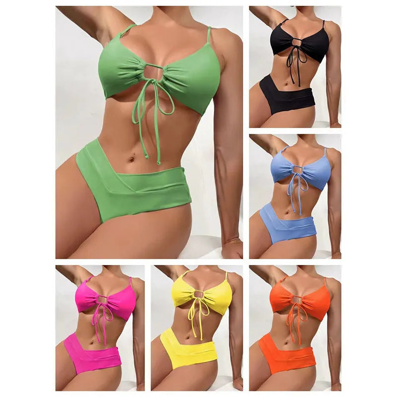 Women's orange tied bow bikini with split brief style on a mannequin.