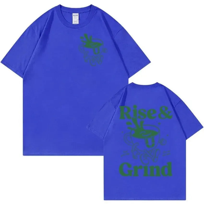 Loose fit linen t-shirt with a cartoon graphic of a green coffee bag and 'Rise And Grind' text.