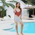 Orange hand crochet beach overskirt with floral pattern and tassel decoration