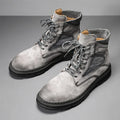 Men's frosted leather vintage Martin boots with thick rubber sole in black, shown on foot.