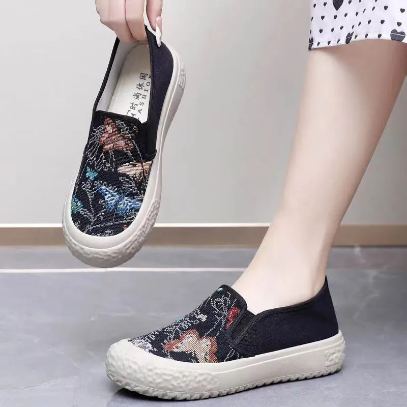 Old Beijing women's canvas slip-on shoes with soft plastic soles in black and white colour options