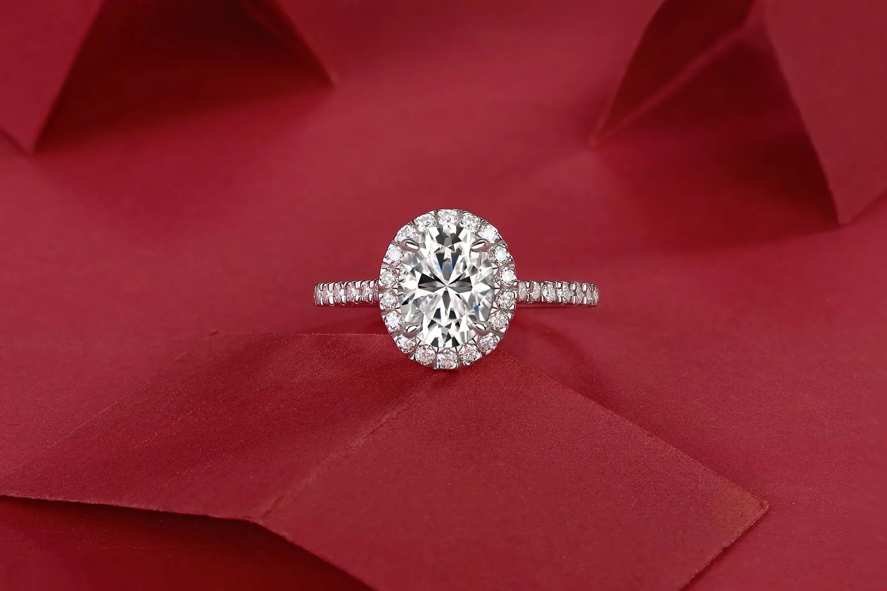 Audrey moissanite wedding ring set with egg-shaped 7x9mm stone in S925 silver platinum plating on white background