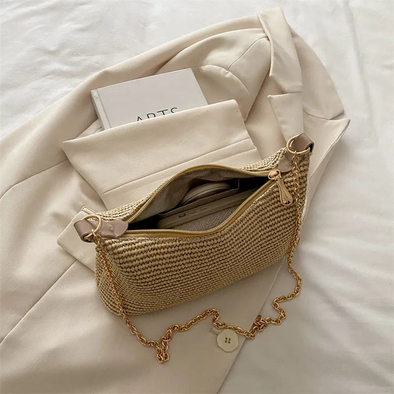 Woven straw crossbody handbag with horizontal square shape and phone compartment