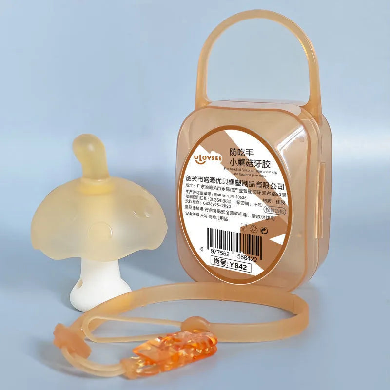 Small pink mushroom-shaped chew toy with transparent storage box and silver nano chain on a white background.