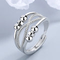 Rotatable copper ring with open design double-layered hollow line construction in platinum colour geometric shape