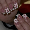 Set of 24 short square nail wraps with French tips and bow, tulip, and starry sky designs on a backing card.