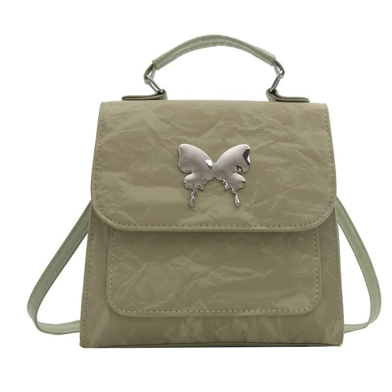 Women's PU leather backpack in multiple colours with bow detailing and hand-carrying option