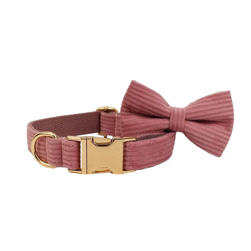 Red corduroy dog collar and leash set with matching vest, bow tie, and poo bag