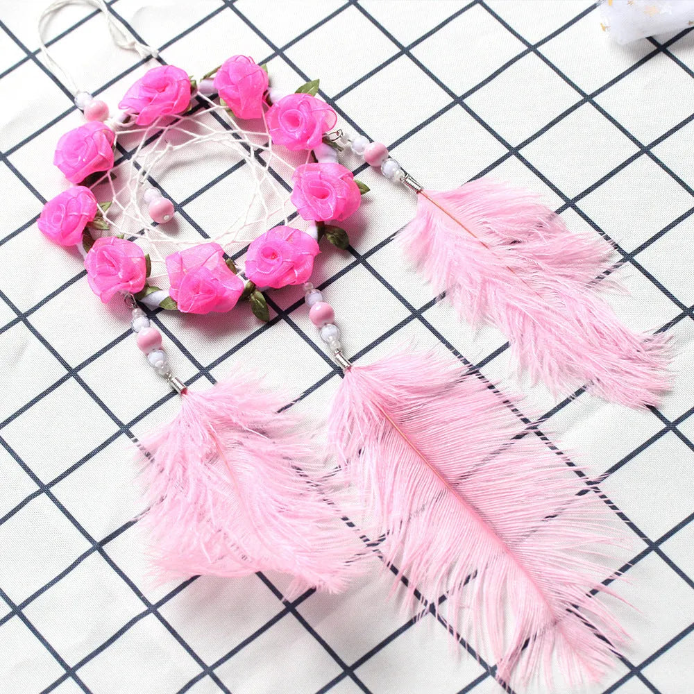 Pink ostrich feather dreamcatcher wind chime ornament measuring 10cm for wall decoration