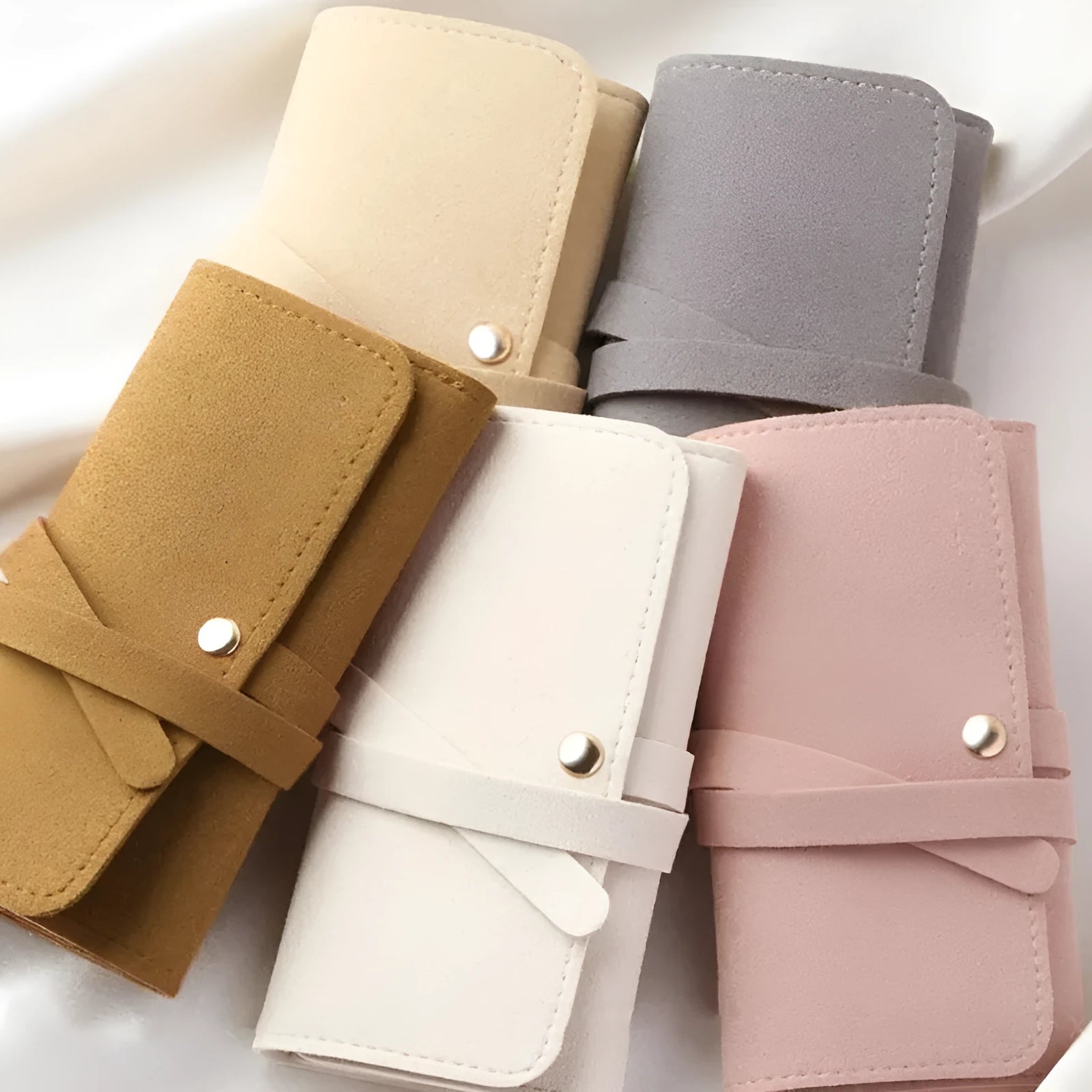 Brown PU leather and microfiber jewellery storage bag for earrings, rings and watches.