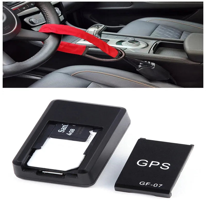 Small black magnetic GPS car tracker with USB charging cable on a metal surface.